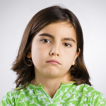 Portrait of a little girl making a serious expression