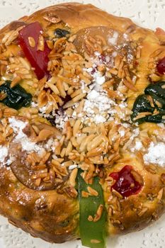 Portuguese King Cake is a famous christmas celebration cake with dry nuts and crystalized fruits.