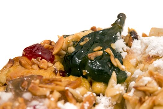 Portuguese King Cake is a famous christmas celebration cake with dry nuts and crystalized fruits.