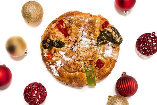 Portuguese King Cake is a famous christmas celebration cake with dry nuts and crystalized fruits.