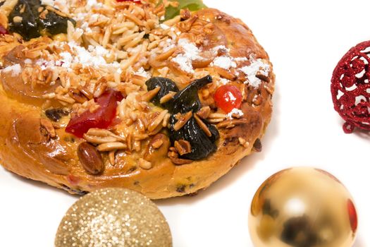 Portuguese King Cake is a famous christmas celebration cake with dry nuts and crystalized fruits.