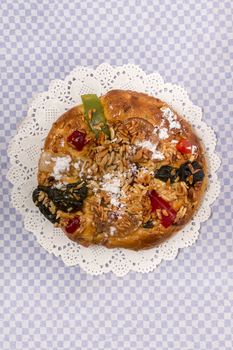Portuguese King Cake is a famous christmas celebration cake with dry nuts and crystalized fruits.