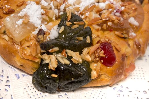 Portuguese King Cake is a famous christmas celebration cake with dry nuts and crystalized fruits.