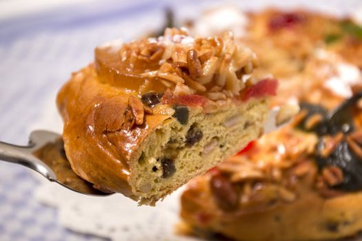 Portuguese King Cake is a famous christmas celebration cake with dry nuts and crystalized fruits.
