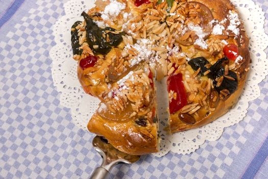 Portuguese King Cake is a famous christmas celebration cake with dry nuts and crystalized fruits.