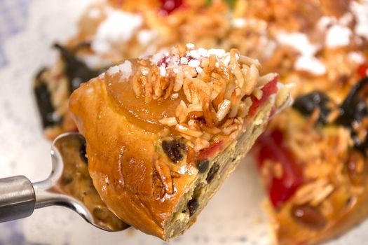 Portuguese King Cake is a famous christmas celebration cake with dry nuts and crystalized fruits.