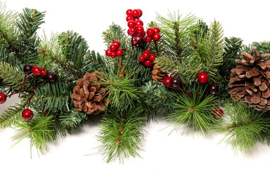 Typical Christmas decorative garland isolated on a white background.