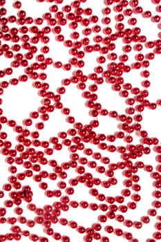 Decorative christmas red beads isolated on a white background.