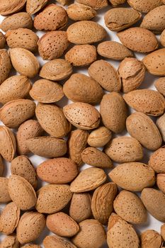 Group of sweet almonds all together on a pile.