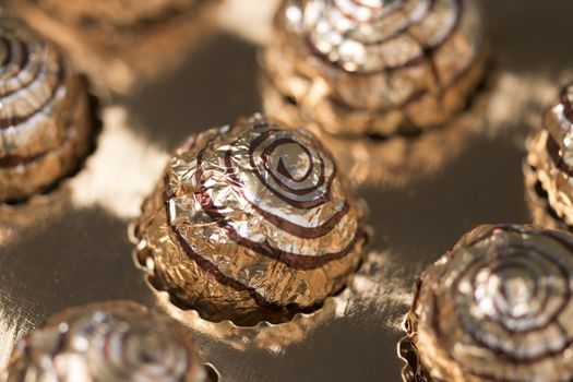 Box of sweet round chocolate candies for christmas celebrations.
