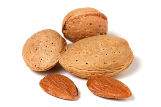 Sweet almonds with seeds isolated on a white background.