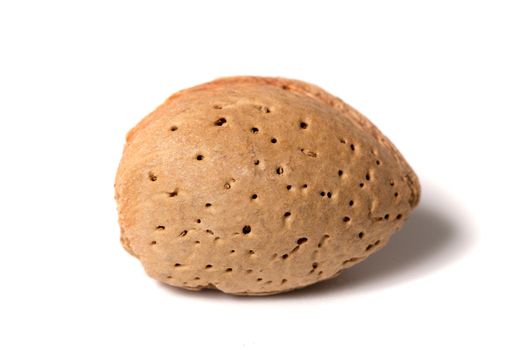 One sweet almond isolated on a white background.