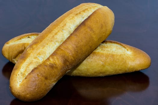 two breads on the kitchen table ready for have a breakfast