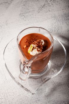 Glass with Chocolate Mousse Dessert served on a wooden surface