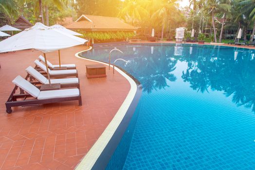 pool bed near swimming pool in tropical resort.