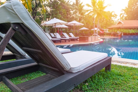 pool bed near swimming pool in tropical resort.