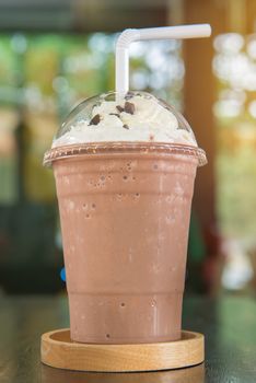 Chocolate smoothie or Chocolate frappe and whipping cream topping in cafe.