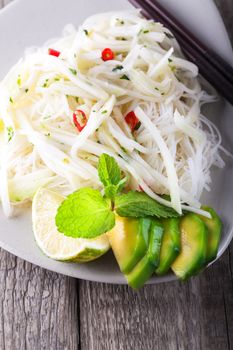 Spicy kohlrabi noodles, dressing: fish sauce, vinegar rices, lime garlic and ginger