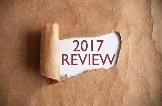 Torn piece of scroll uncovering 2017 review