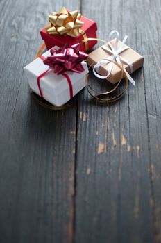 Xmas gifts over a wooden backdrop