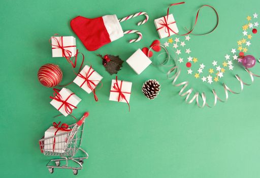 Christmas gifts, baubles, and decorations coming out of a shopping cart