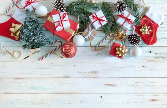 Christmas gifts and decorations over a wooden background