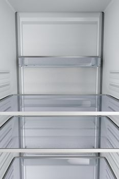 View from inside of an empty fridge with closed door