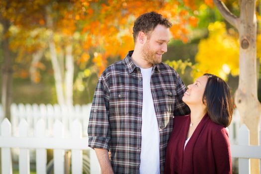 Outdoor Fall Portrait of Chinese and Caucasian Young Adult Couple.