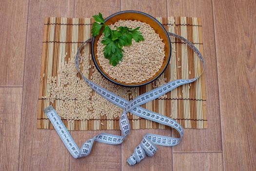 Wooden ware of folk art with pearl barley and centimeter, the Russian Khokhloma