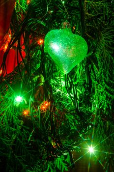 Christmas lights on a tree in different colors are classic symbol of Christmas.