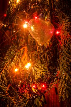 Christmas lights on a tree in different colors are classic symbol of Christmas.