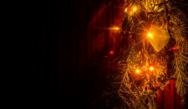 Christmas lights on a tree in different colors are classic symbol of Christmas.