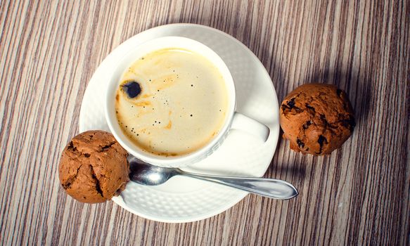 Chocolate muffin and coffee is ideal for a good breakfast.