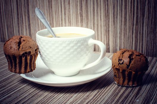 Chocolate muffin and coffee is ideal for a good breakfast.