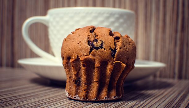 Chocolate muffin and coffee is ideal for a good breakfast.