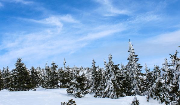 Snowy Czech mountain peak in the main ski season.