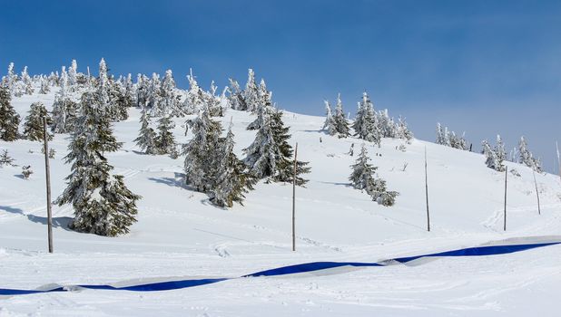 Snowy Czech mountain peak in the main ski season.