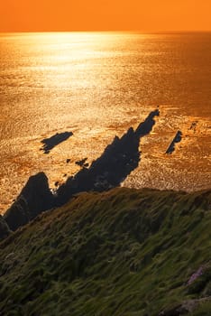 rocky jagged coastline and cliffs sunset in county kerry ireland on the wild atlantic way