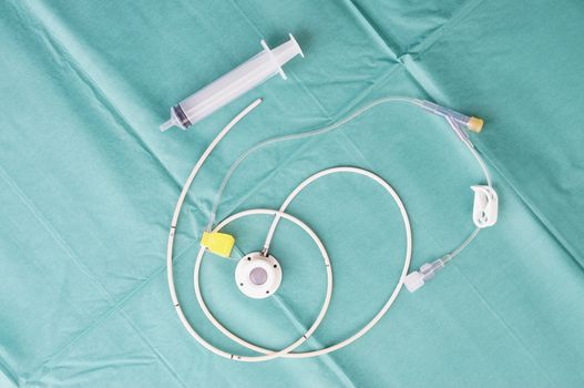 Port a catheter or central venous port insertion, puncture at chest wall to aorta artery  a medical device as silicone cartridges ,has flexible tube with needle and syringe.                            