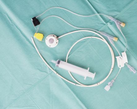 Port a catheter or central venous port insertion, puncture at chest wall to aorta artery  a medical device as silicone cartridges ,has flexible tube with needle and syringe.                         