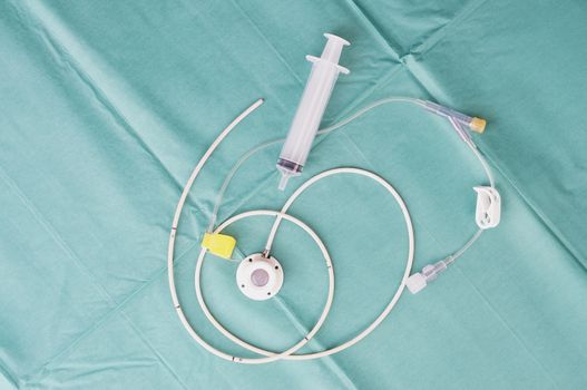 Port a catheter or central venous port insertion, puncture at chest wall to aorta artery  a medical device as silicone cartridges ,has flexible tube with syringe.                            
