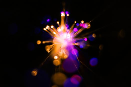 Colorful light explosion on black background. Futuristic wallpaper