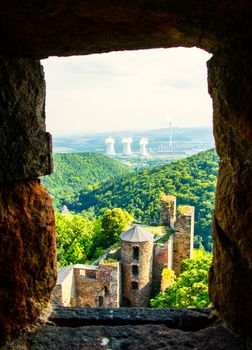 View of the contrast of nature and factory chimneys.