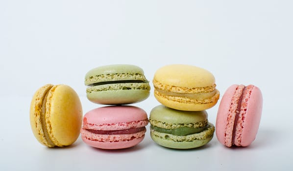 Colorful sweet macaroons on the white background.