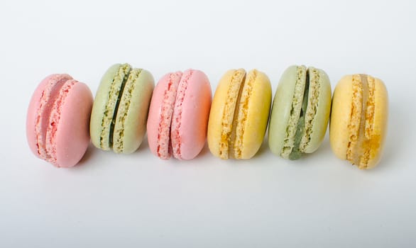 Colorful sweet macaroons on the white background.