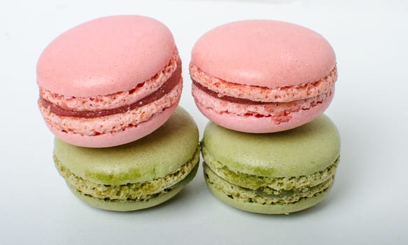 Colorful sweet macaroons on the white background.