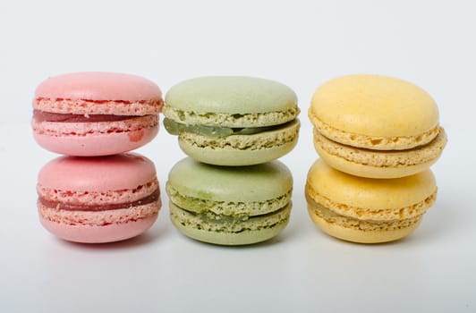 Colorful sweet macaroons on the white background.