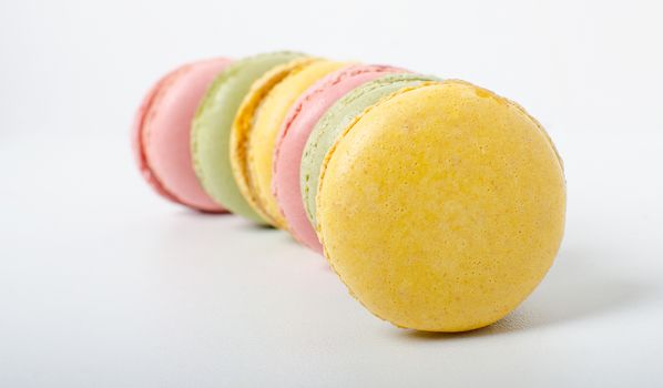 Colorful sweet macaroons on the white background.