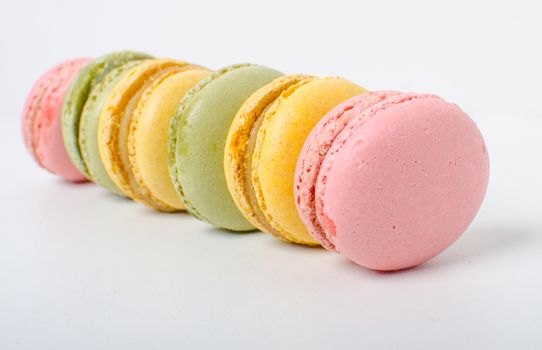 Colorful sweet macaroons on the white background.