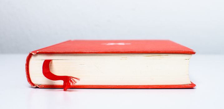 A pile of old, discarded books suited to learning.